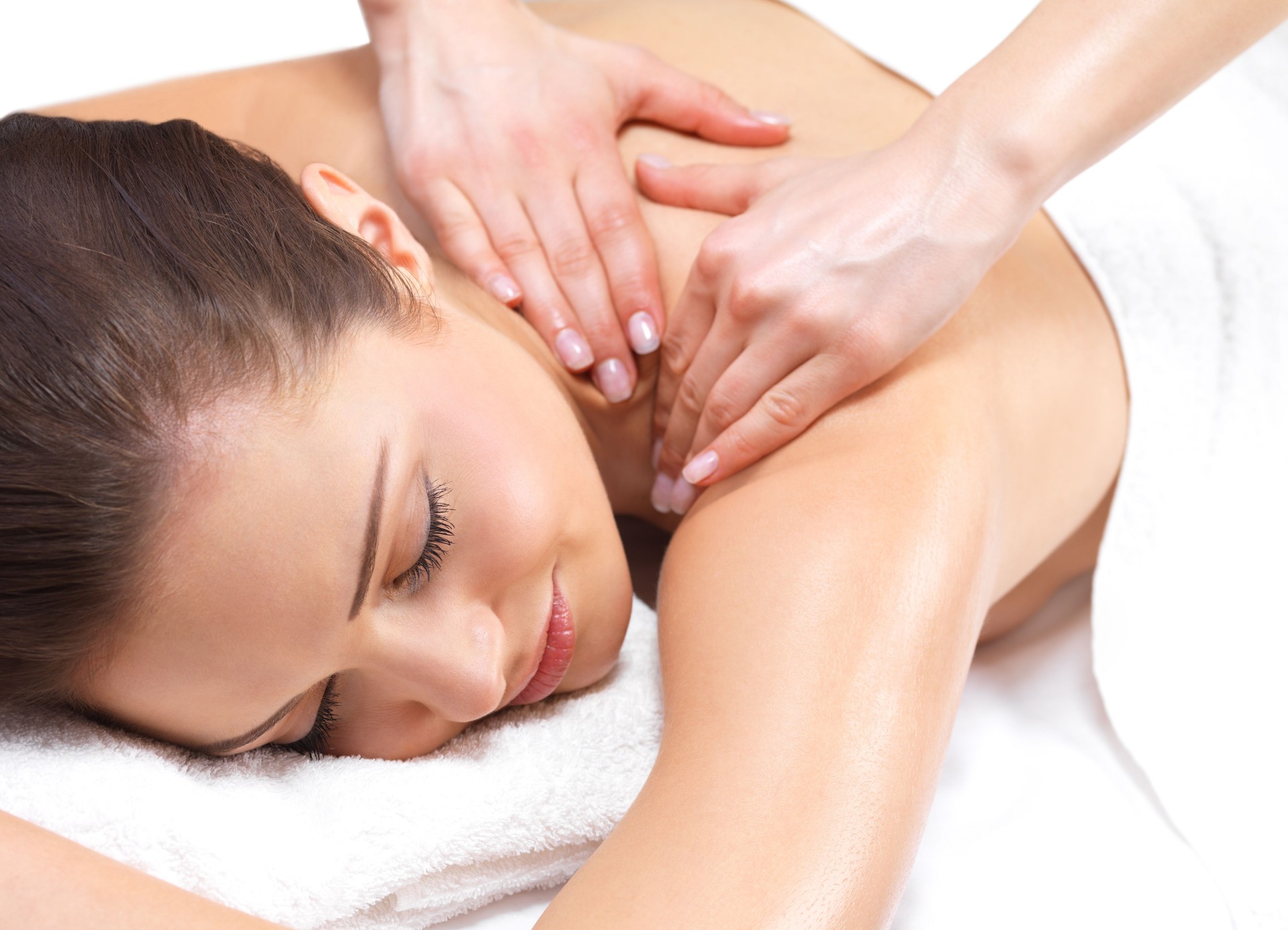 Close-up of young woman receiving back massage